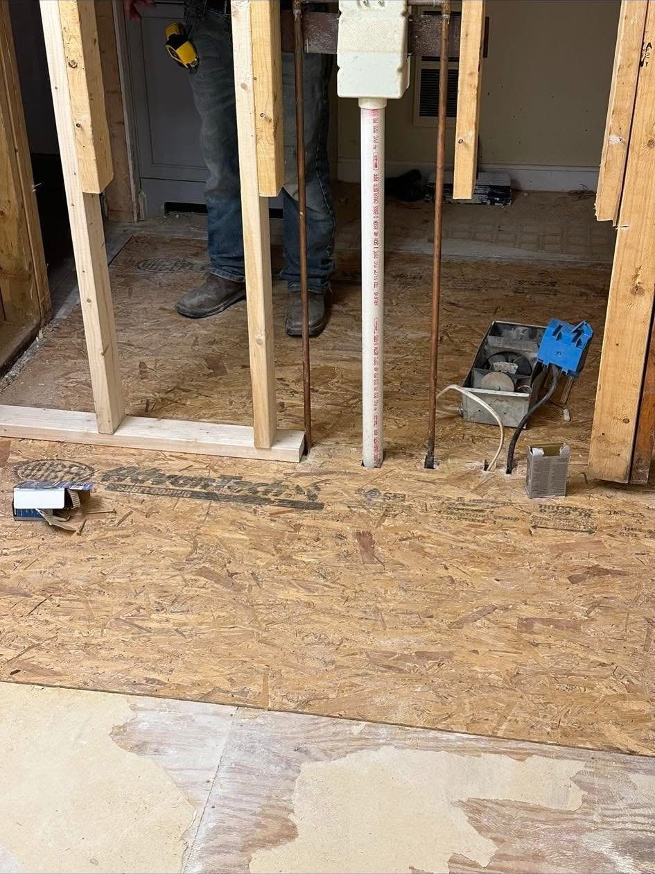 Precision Cleaning Services crew working on a subfloor repair job site